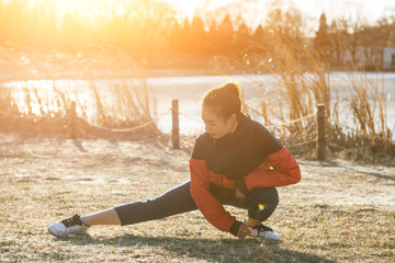 Exercise woman stretching hamstring leg muscles before running