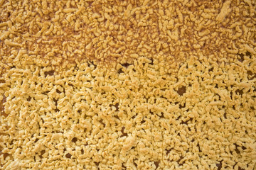 grated pie background. Food background. Bright orange color.