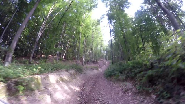 Speed on the forest road. Fast and extreme driving in the woods. Safari suv. Tires in preparation for race. Off road sport truck between mountains landscape.