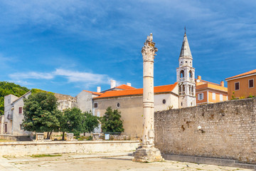 Pillar of Shame and Saint Elias church in historic center of Zadar town, Croatia, Europe.