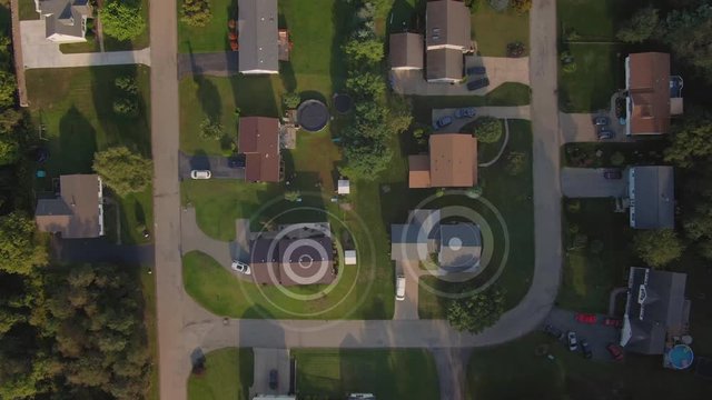 An aerial top down flyover view establishing shot of a typical Pennsylvania residential neighborhood with WiFi hotspot target markers over random homes. Pittsburgh suburbs.	 	