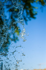 transparent falling water vertical flows, close up