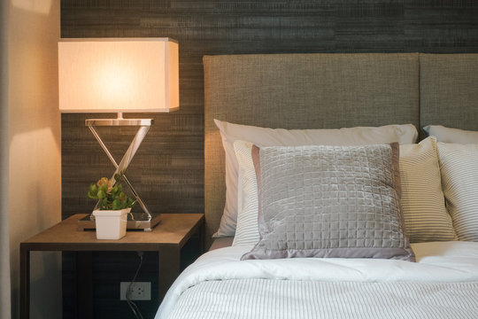 Hotel style bedding with white shade reading lamp