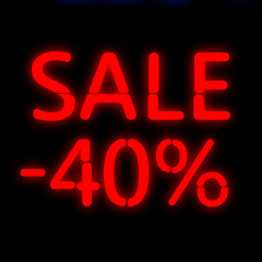 The neon text of the inscription sale.