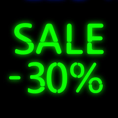 The neon text of the inscription sale.
