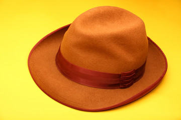 Vintage Autumn Mans Hat yellow background 