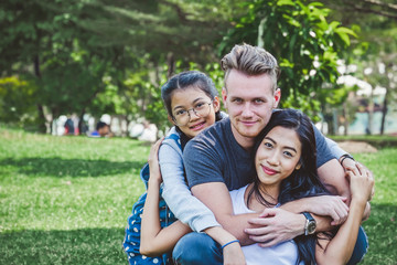 diversity family portrait at green park, happy family concept