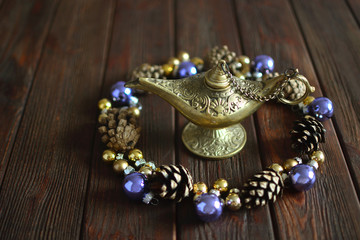 Aladdin lamp and Christmas decoration. Concept of a miracle.