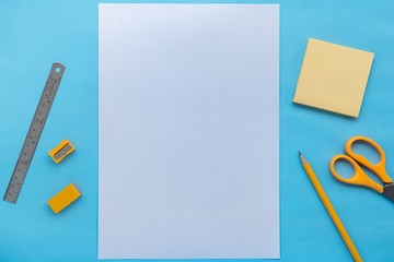 stationery and paper on blue color background, flat lay picture.