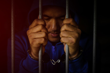 Male prisoners were arrested, handcuffed to a light-dark
