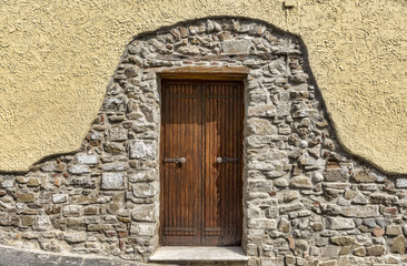Fototapeta na wymiar Medieval wooden door with windows