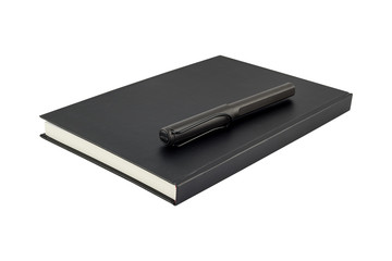Black notebook and pen over isolated on white background