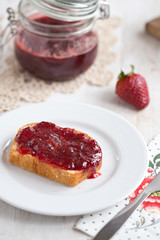 a slice of bread with strawberry jam 
