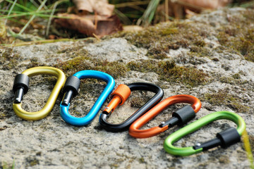 Carabiner  on rocky background.