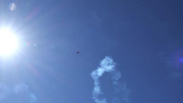 the airplane performs the "corkscrew" trick climbing vertically into the sky.
