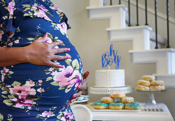 Conceptual close up photo of Pregnant African American woman celebrating baby shower party