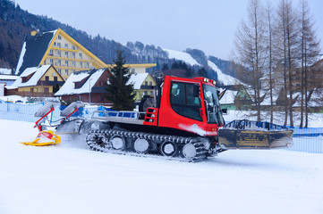 Red machine for skiing slope preparations