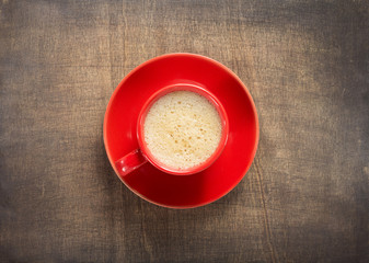 cup of coffee on dark wooden background