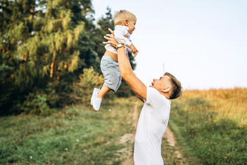 Fototapeta premium Father and his little son have fun outdoor