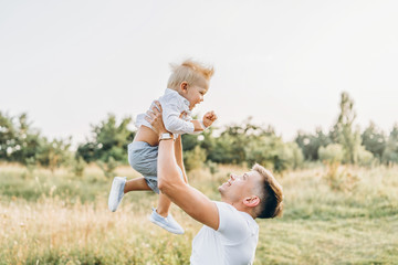 Fototapeta premium Father and his little son have fun outdoor
