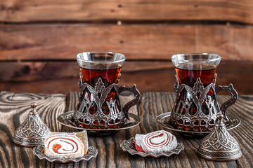 Fragrant Turkish tea and Turkish sweets in national dishes