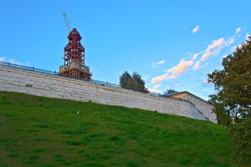 The shaft, the Kremlin wall and the construction of the reconstructed Kremlin. Kostroma, Russia.