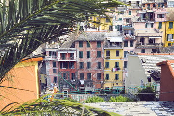 Beautiful old Italian town with colorful houses and flowers on summer day.