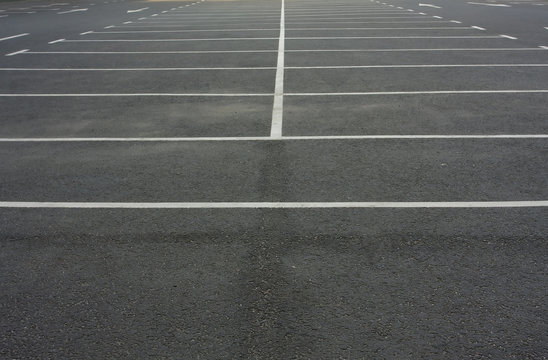 Car parking lot with white lines mark. White markings on asphalt in empty parking lot.