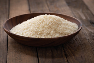 Fototapeta na wymiar raw rice on wood