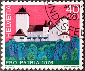 Old swiss building on postage stamp
