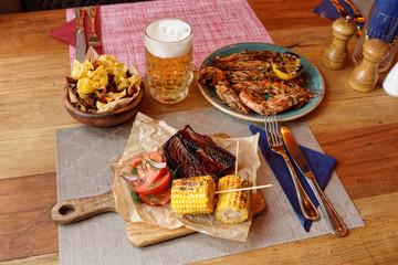 Assortment of grilled foods on restaurant table