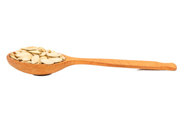 Pumpkin seeds in a spoon