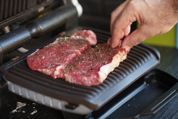roast meat on electrical roaster close up