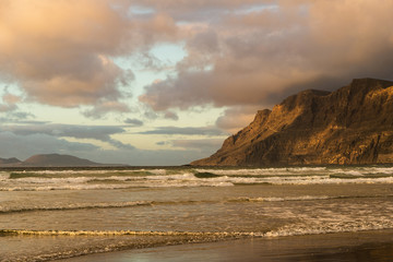 The magic light of the passing sun painted the ocean and mountains