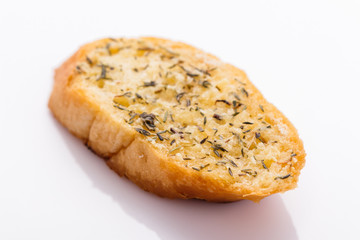 fragrant garlic bread on a white acrylic background