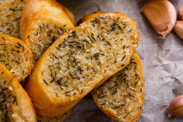 fragrant garlic bread on a rustic wooden background