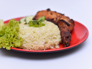 a set of a plate of chicken rice