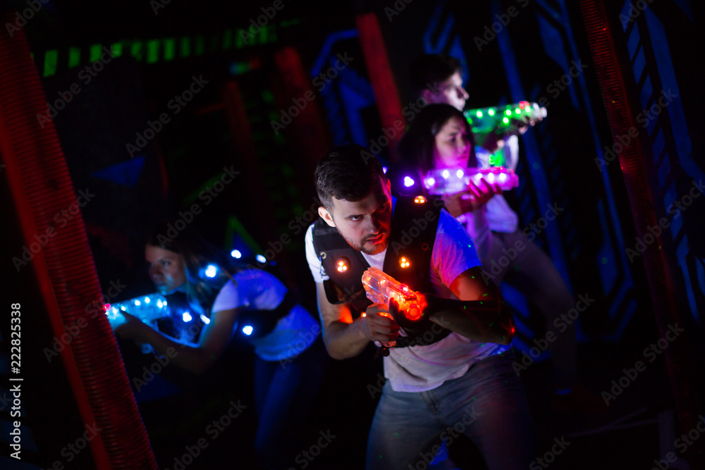 Wall mural emotional guy playing laser tag