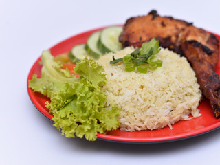 a set of a plate of chicken rice
