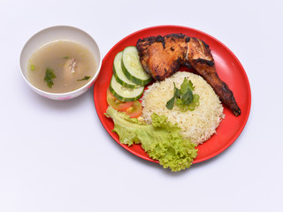 a set of a plate of chicken rice