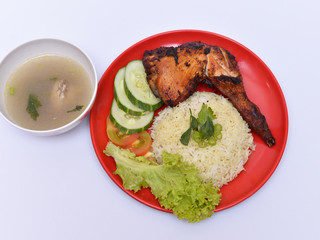 a set of a plate of chicken rice
