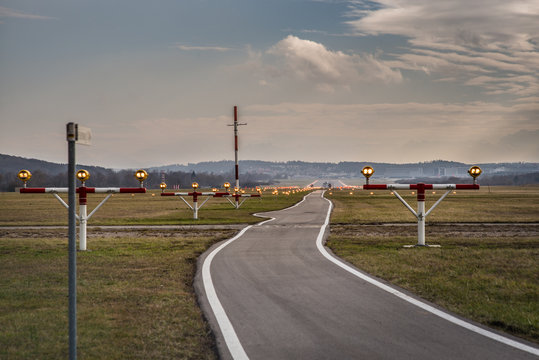 Approach light system at the airport with runway at the end of  this guidance system 