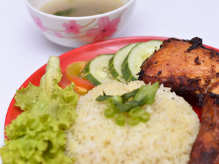 a set of a plate of chicken rice