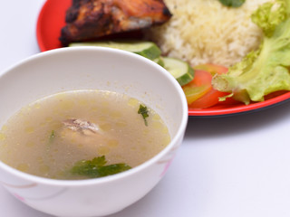 a set of a plate of chicken rice