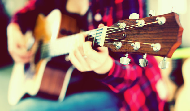 Focus on head of guitar