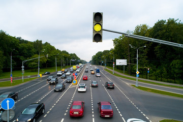 A traffic light shows a yellow signal.