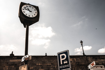 Retro vintage clocktower style street old clock tower in european city scene at daylight under...