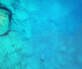 Aerial view at the sea. Turquoise water from air as a background from air. Natural seascape at the summer time. Seascape from drone