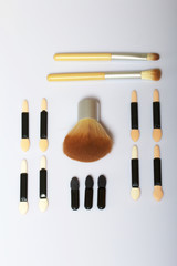Beauty knolling. Brushes for applying makeup of different sizes and highlighter.