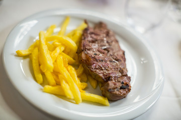 striploin steak with potato chips